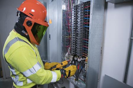 DSC00191_Smaller Electrical Worker Wearing Rubber Insulating Gloves and Leather Protectors